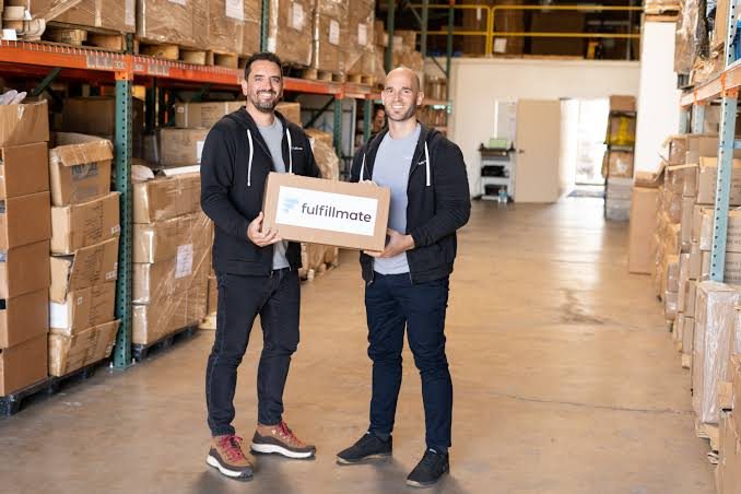 Ben Carman and his co-founder in one of the Fulfillmate US warehouses